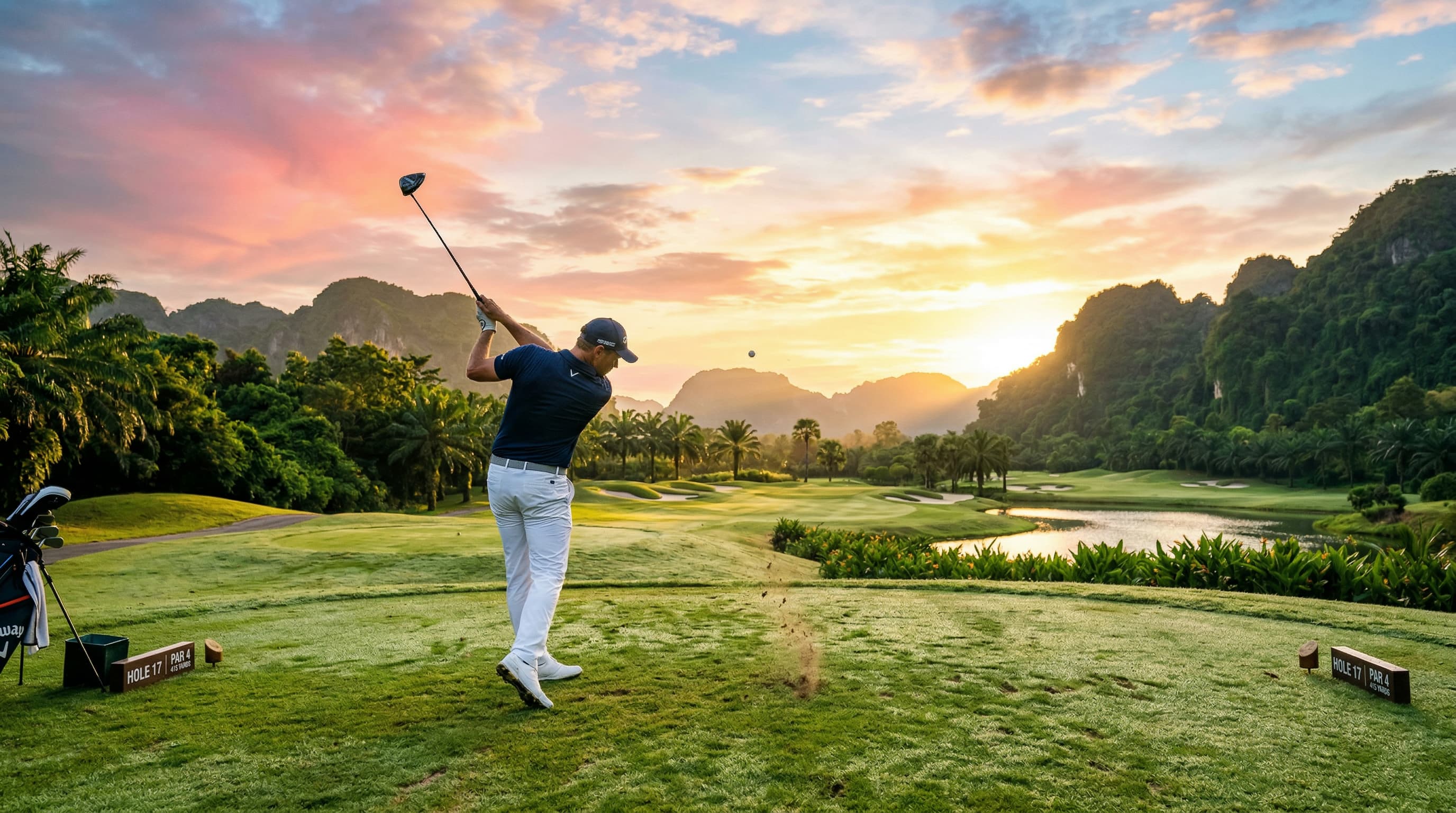 Golfer teeing off at sunrise on a Thailand golf course